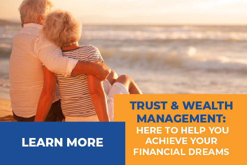 Retired couple sitting on the beach